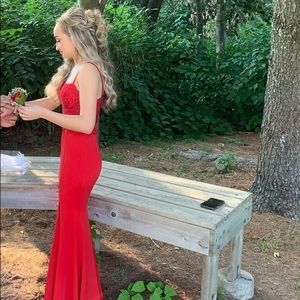 red prom dress. corset top, into a mermaid dress. one piece.